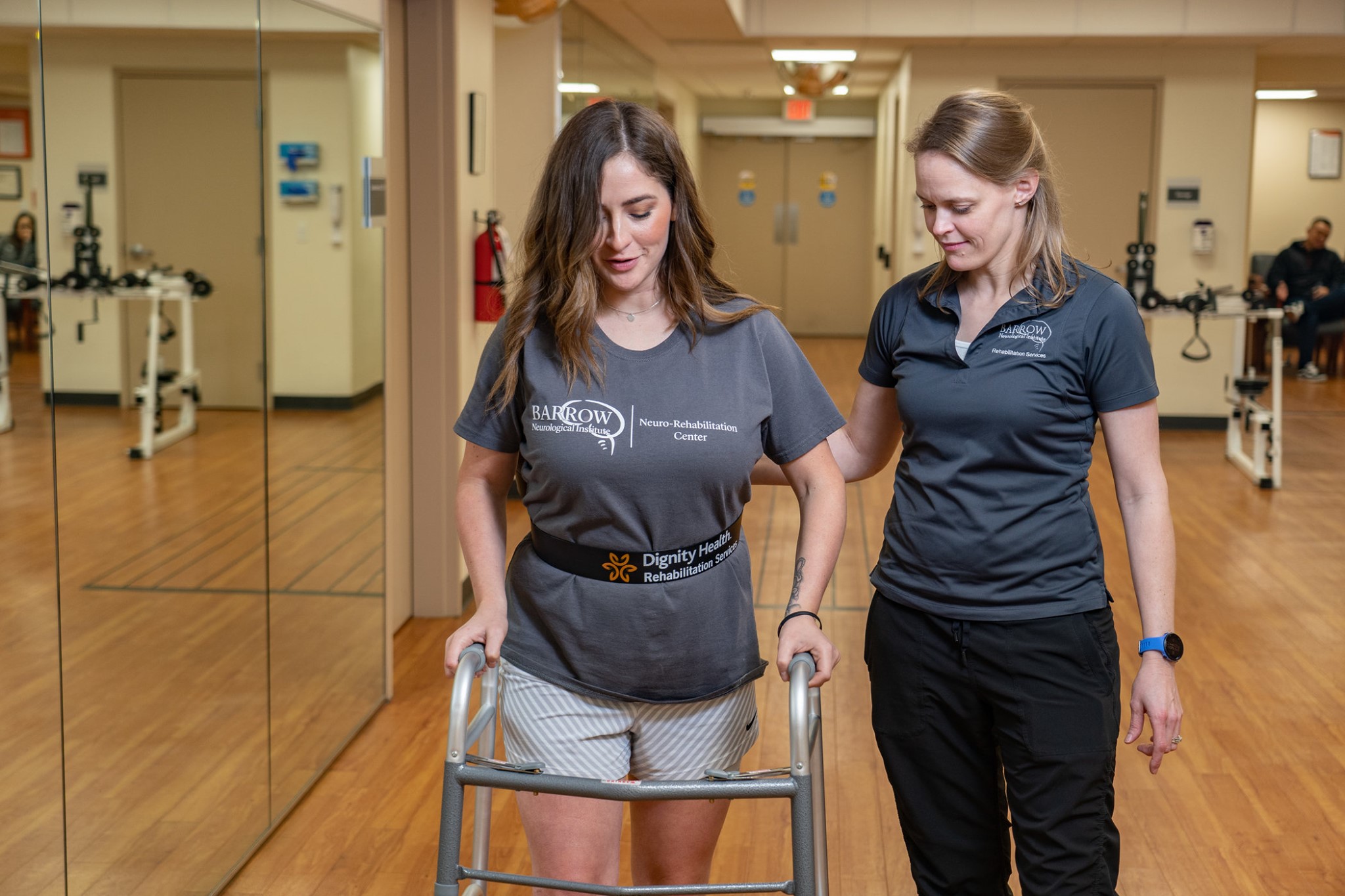 Therapist assisting patient to walk at the Neuro-Rehabilitation Center at Barrow.